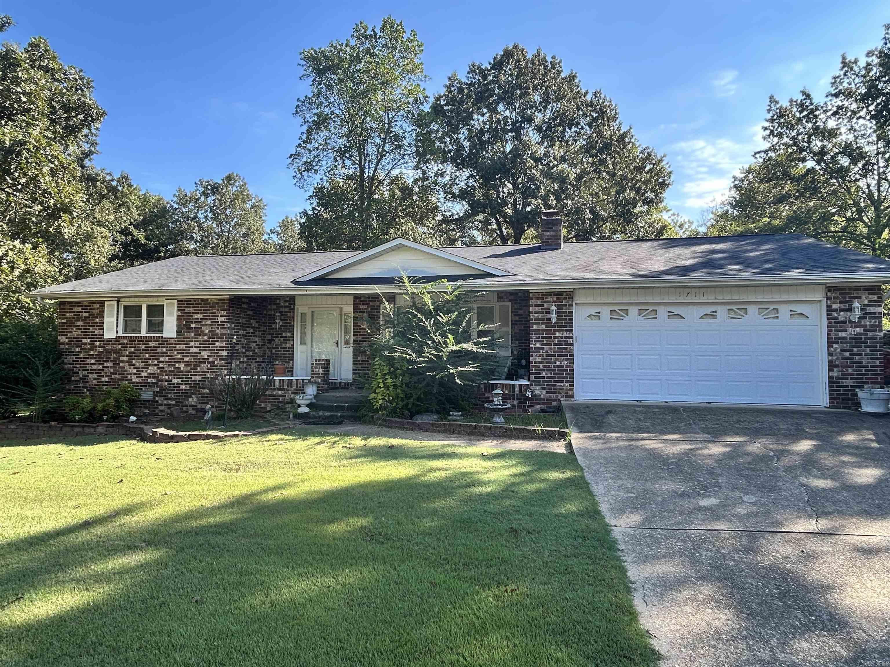 Great home sitting on just over 1/2 an acre, it includes a 448 sq. ft. heated and cooled sunroom, a 36x30 (1150 sq. ft.) insulated shop with its own HVAC system, the home is very roomy, with a nice gas log fireplace, and a great back porch for sitting and drinking coffee in the morning. Nestled in a quiet neighborhood in the mountains, this home is in great condition and currently livable, with some fresh paint and new floors this home would be the perfect family home. Generator and shed will convey with a full price offer.