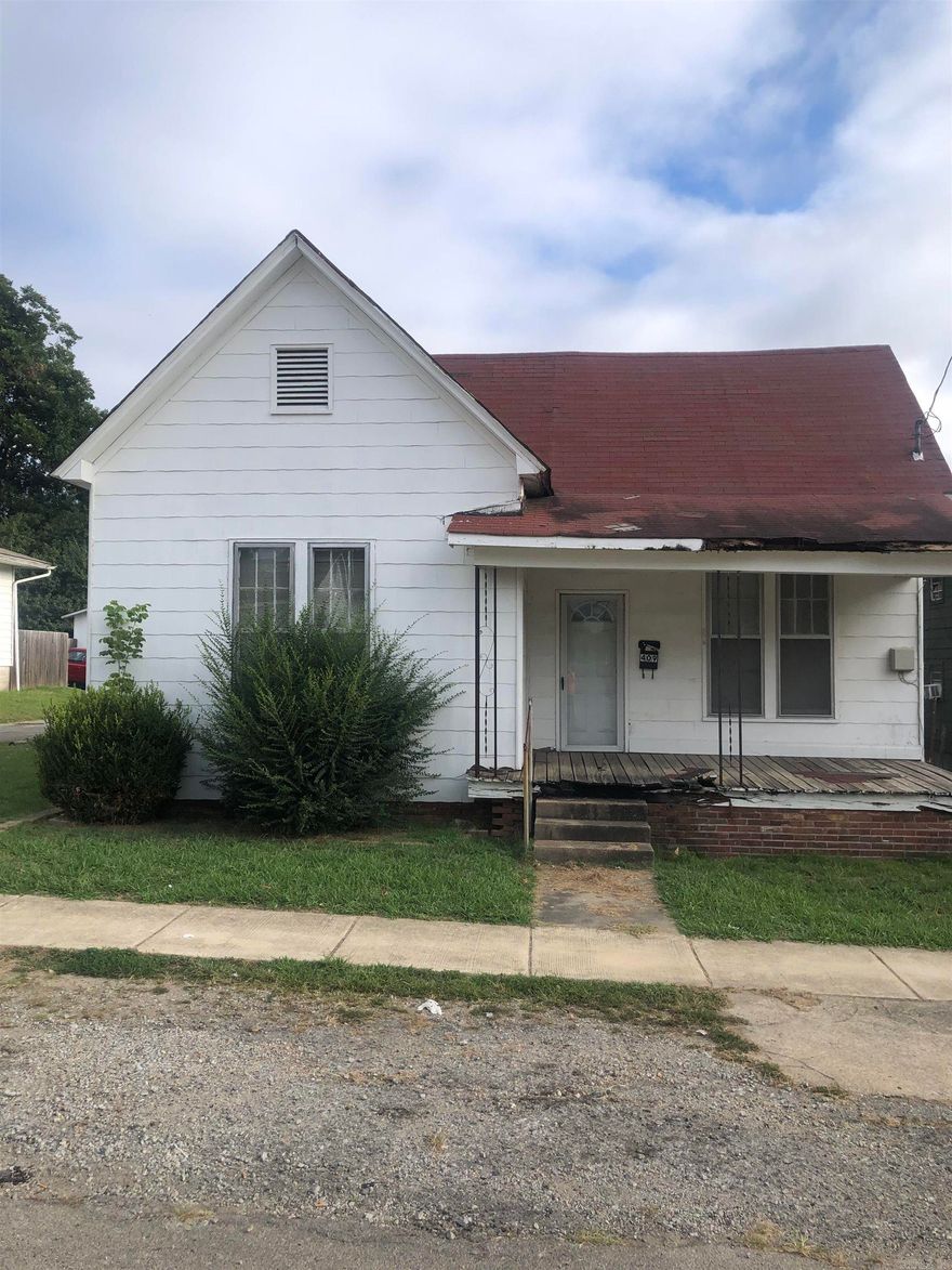 This home will be sold AS-IS while it could be used for an investment property itself, one could demolish it and build a small framed house as an investment property. To best describe the house look at the pictures. It does need clean up but could have potential!  Call your REALTOR today for a time to go and check it out.