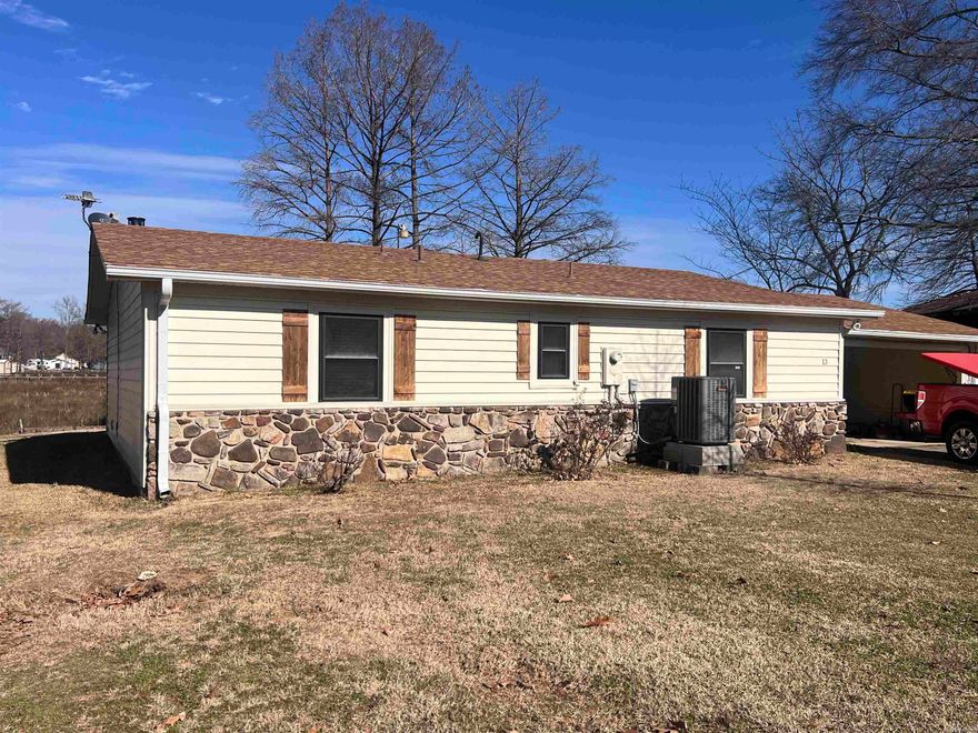 Lake Front home that has been updated! 2 Bedrooms on the same level with lots of storage in both. 16x20 Screened Porch/Deck has electric and overlooks the lake to provide gorgeous views while enjoying coffee, bug free! Private Boat House with electric boat hoist. Heat and Air system is 3 years old. New Roof in 2020! Covered carport that could be a garage, also has as RV plug! Flood insurance is required. Additional Photos to come. Agent - see remarks.