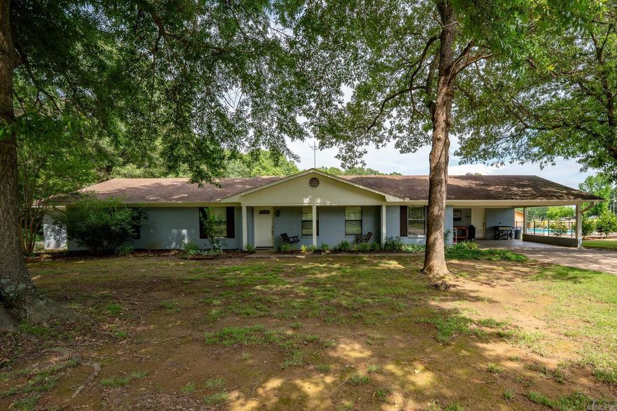 Nestled on a beautifully maintained 3+ acre lot, this 4 bed/2 bath home perfectly blends comfort, functionality, & outdoor living. Step inside to find an inviting large family room w/ wood burning fireplace. Eat in kitchen offers plenty of cabinet space & incredible natural light. Dedicated office is right off kitchen area & overlooks front yard. Primary bedroom features an en-suite full bath & walk in closet doubles as a tornado shelter. Three additional bedrooms each provide great closet space for family, guests, or hobbies. Full bath is off the main hallway w/ a pocket door separating the shower from vanity area. Oversized laundry room has large pantry, room for craft/sewing area & extra appliances. Don't miss the extra storage closet off the laundry too. Outside, enjoy your days by the in ground pool w/ concrete patio area & fence surrounding it. The yard offers plenty of room for a garden & there is an extra storage building/barn out back. Livestock are allowed and property will come with two goats if buyer wants them! Experience the tranquility of country living while still being just a short drive to town amenities. Don't miss out on this rare find! Agents see remarks.
