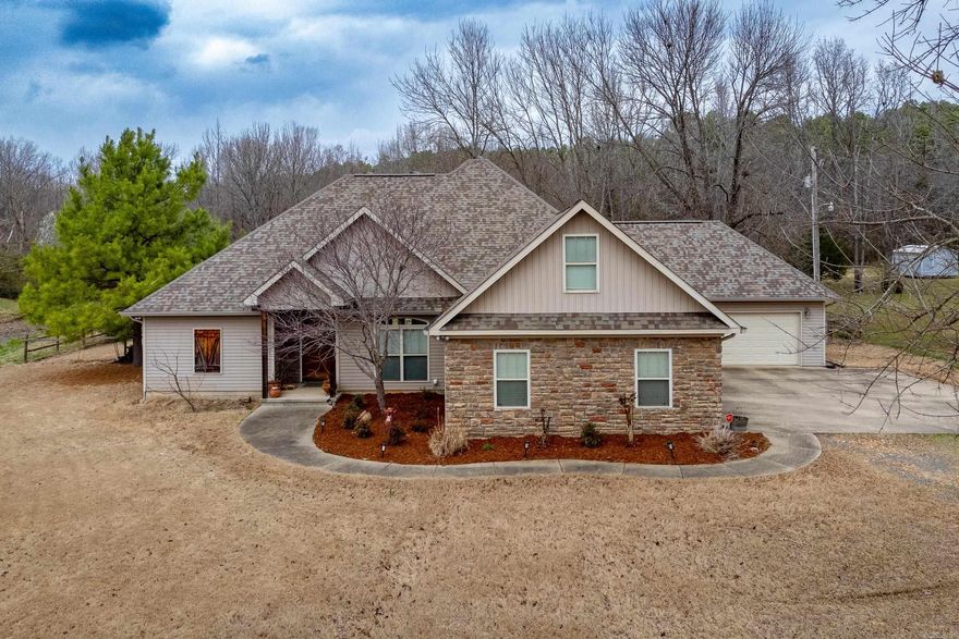 This property is a haven for those seeking a peaceful lifestyle without sacrificing proximity to city amenities. Enjoy the best of both worlds – the tranquility of a rural setting combined with the convenience of being just minutes away from shopping, dining, etc. The highlight of this property is undoubtedly the saltwater pool, a refreshing oasis that beckons on warm summer days. The expansive yard provides ample space for outdoor activities and entertaining, ideal for both relaxation and recreation. Plus an open-concept living space featuring large windows that invite abundant natural light, creating a bright and airy atmosphere. New roof 2023. Two  2 car garages.