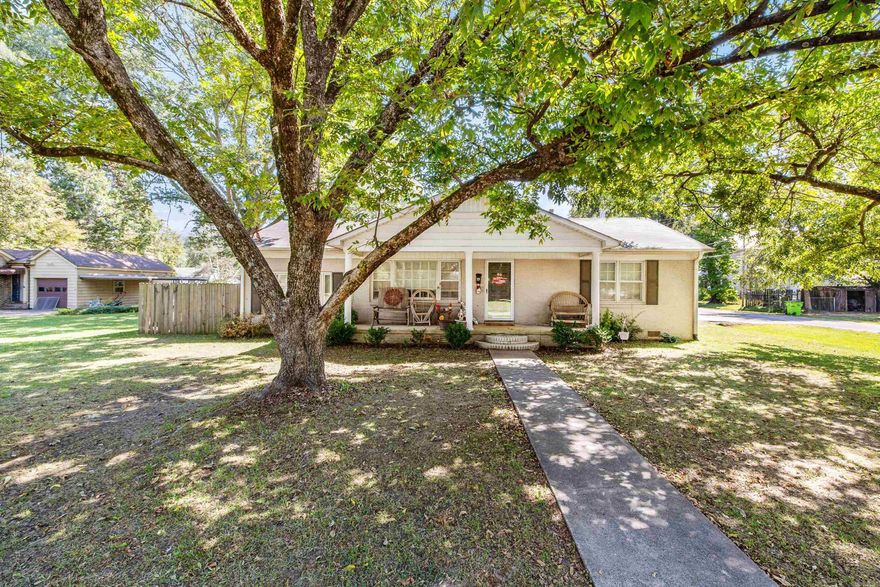 This home in downtown Lonoke is a must-see. The property is approx. 1,809 sq. ft. and sits on a corner lot with well-established shade trees and a fenced-in back yard. Stepping into the home, you're greeted with beautiful vinyl wood floors and a gas log fireplace. In the kitchen, you'll find updated kitchen cabinets, a modern range hood over the island, and stainless steel appliances. The house had a total renovation to the master bedroom, bathroom, closet, and kitchen in 2019. This home has 4 bedrooms and offers great features like a tankless gas water heater, sealed crawl space, high-efficiency HVAC system, and fiber internet access.  The seller plans to replace the flooring in the back bedroom, repair some shingles on the roof, and a section of the roof above the carport before closing.
