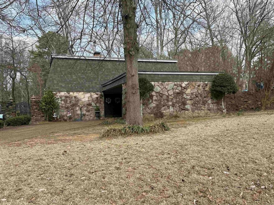 Refined Lakefront Living in East Edgewood  Experience elevated waterfront living in this exceptional 4-bedroom residence nestled on the lake in East Edgewood. Designed to capture both light and landscape, this home offers sweeping lake views from the den and the main bedroom, creating a serene backdrop for everyday living.  At the heart of the home, a dramatic floor-to-ceiling stone fireplace anchors the den, offering warmth and architectural presence. A second striking stone fireplace in the upstairs bedroom adds an intimate, lodge-inspired elegance. The combination living and dining room provides a sophisticated yet inviting space for entertaining, seamlessly connected to a well-appointed galley kitchen designed for efficiency and flow.  The main bedroom suite is a true retreat, featuring a private wooden deck overlooking the water — an idyllic setting for sunrise coffee or sunset reflections. Skylights bathe the main bedroom and upstairs bath in natural light, enhancing the airy, tranquil ambiance.  Outdoor living is equally impressive. A stone patio off the den invites lakeside gatherings, while the expansive views create a sense of peaceful seclusion.