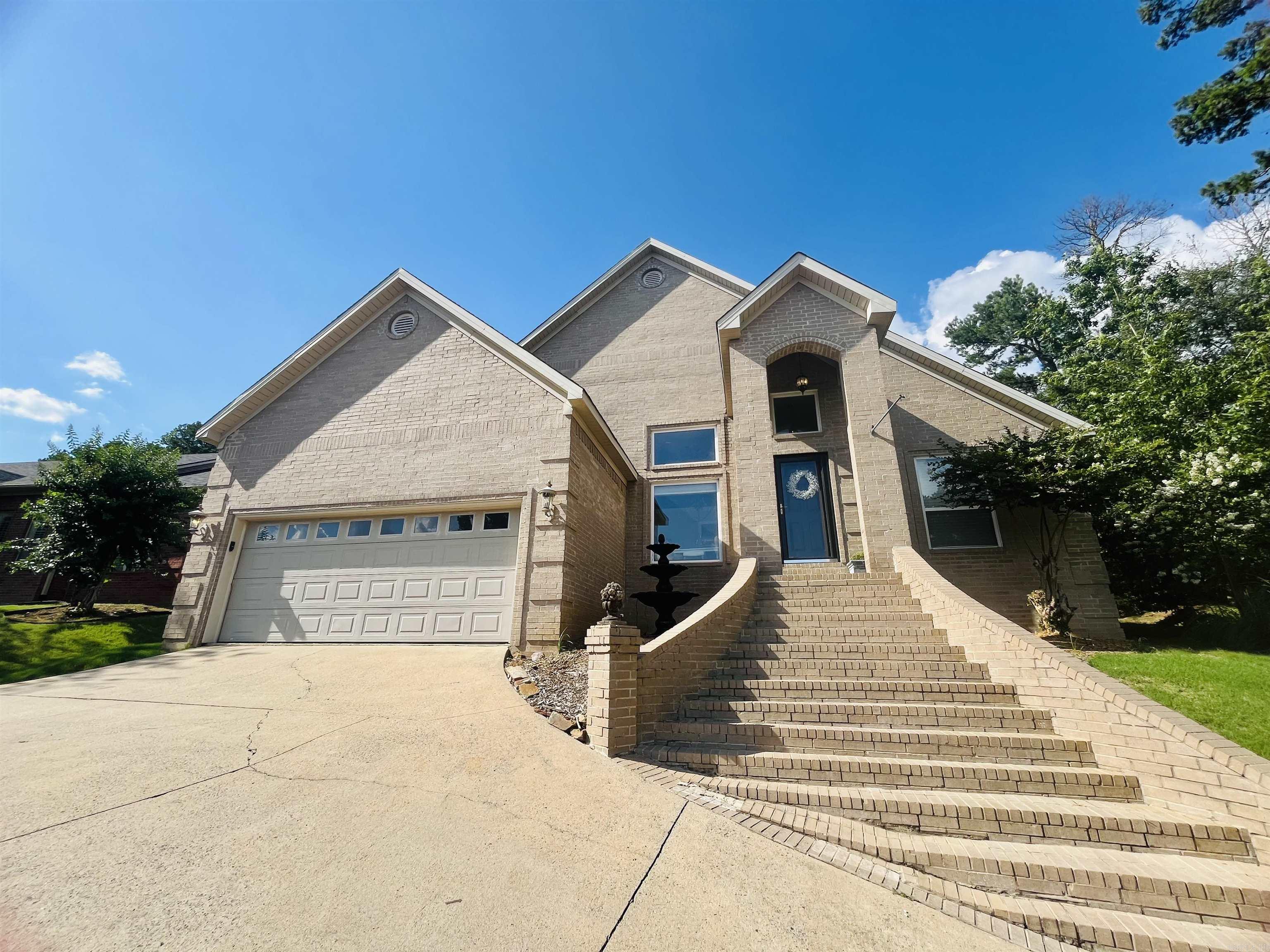 Looking for space, comfort, and style? This stunning 5-bedroom, 3.5-bath home in beautiful Maumelle offers over 2,500 square feet of well-designed living space — perfect for families of all sizes. Cozy up by the fireplace, entertain in the open living area, or unwind in your separate private master suite featuring a spacious tub — your perfect retreat after a long day. You'll find an additional bedroom upstairs, including a powder room and bonus room, great for a game room or office. Home also features a jack and jill bathroom, perfect for anyone with kids or shared sibling space. Whether you're relaxing in the backyard or hosting in your bonus space, this home blends comfort, style, and function. Agents see remarks!