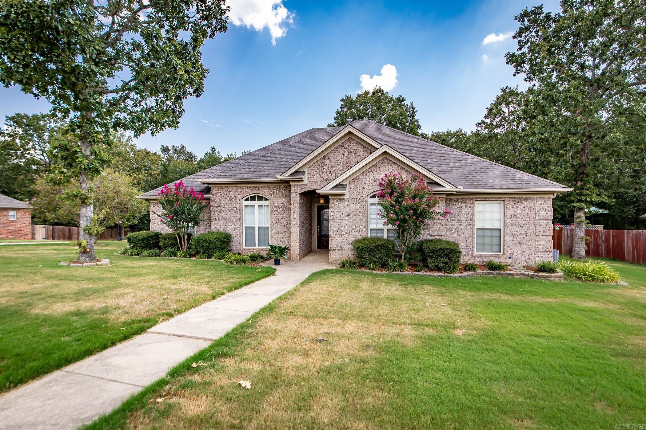 Welcome to 1308 Lost Creek Dr ~ This home is nestled in a quiet neighborhood on a generous corner lot w/green space behind. This 3 bedroom 2.5 bath home features hardwood floors, high ceilings with built-ins and crown molding. The kitchen has wood stained cabinets, stainless steel appliances and lots of storage/counter top space to include a breakfast bar. Additionally, there is a large pantry and a separate oversized laundry room. There is a formal dining room offering plenty of space for family gatherings but don't forget the additional room/space that could be a playroom, small gym, an office or whatever suites your family best. All of the bedrooms are generously sized with a large primary suite! The master bathroom has dual vanities, dual closets and both a shower and jetted soaking tub. Enjoy evenings out back on the private covered patio overlooking a meticulously crafted landscape including separarte garden beds and two pear trees. Call today to schedule your private tour!