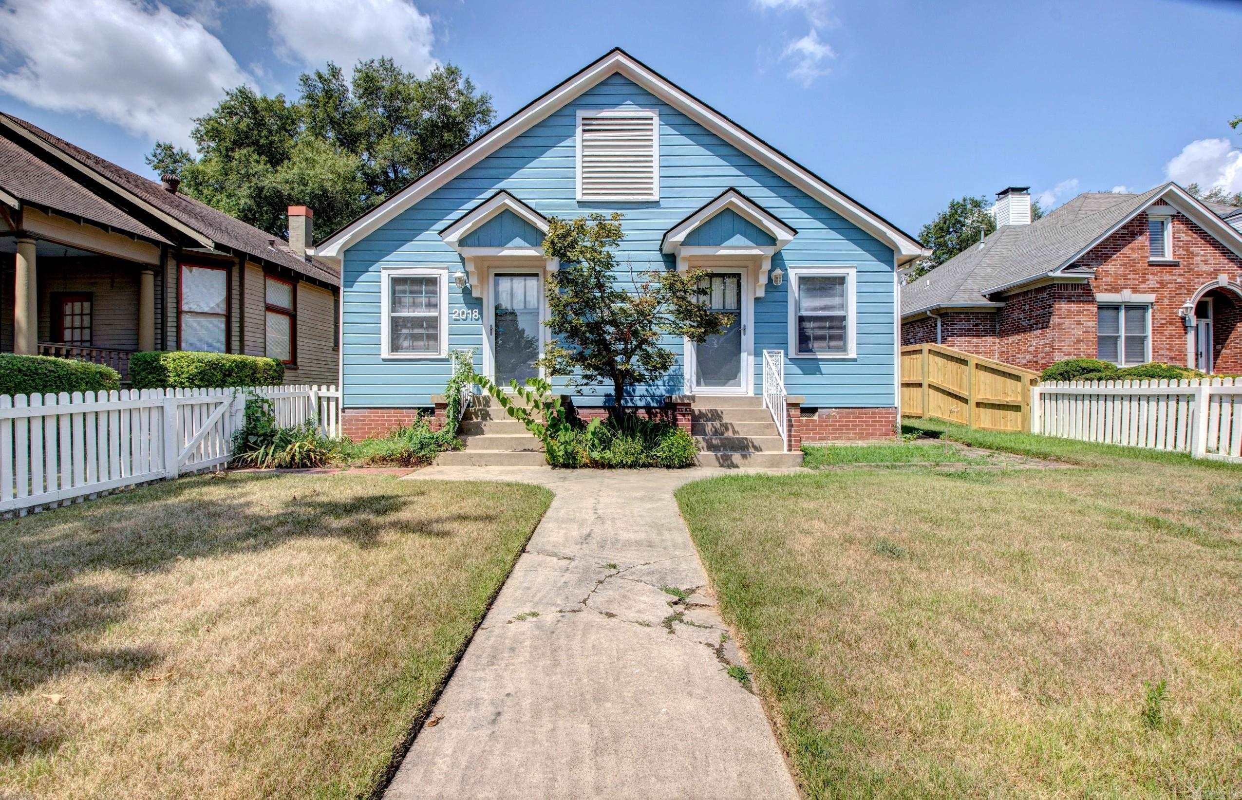 This adorable 2-bedroom, 2- bath cottage offers timeless charm with room to make it your own. Behind the white picket fence you'll find a comfortable living space including a big living room, separate dining area and a cozy kitchen. Seller has done lots of touch ups and has it ready to move into while adding your personal touch to elevate it to next level. Pretty wood floors. Versatile bonus room off the bedroom is perfect for office, craft room, sitting room or a 3rd bedroom. Classic cottage style, friendly neighborhood feel, and the ability to update while you live in it makes it a great find. Perfect for those who value character, location and potential. Bedrooms and baths on opposite sides of the house. Great layout. Large, fenced yard.