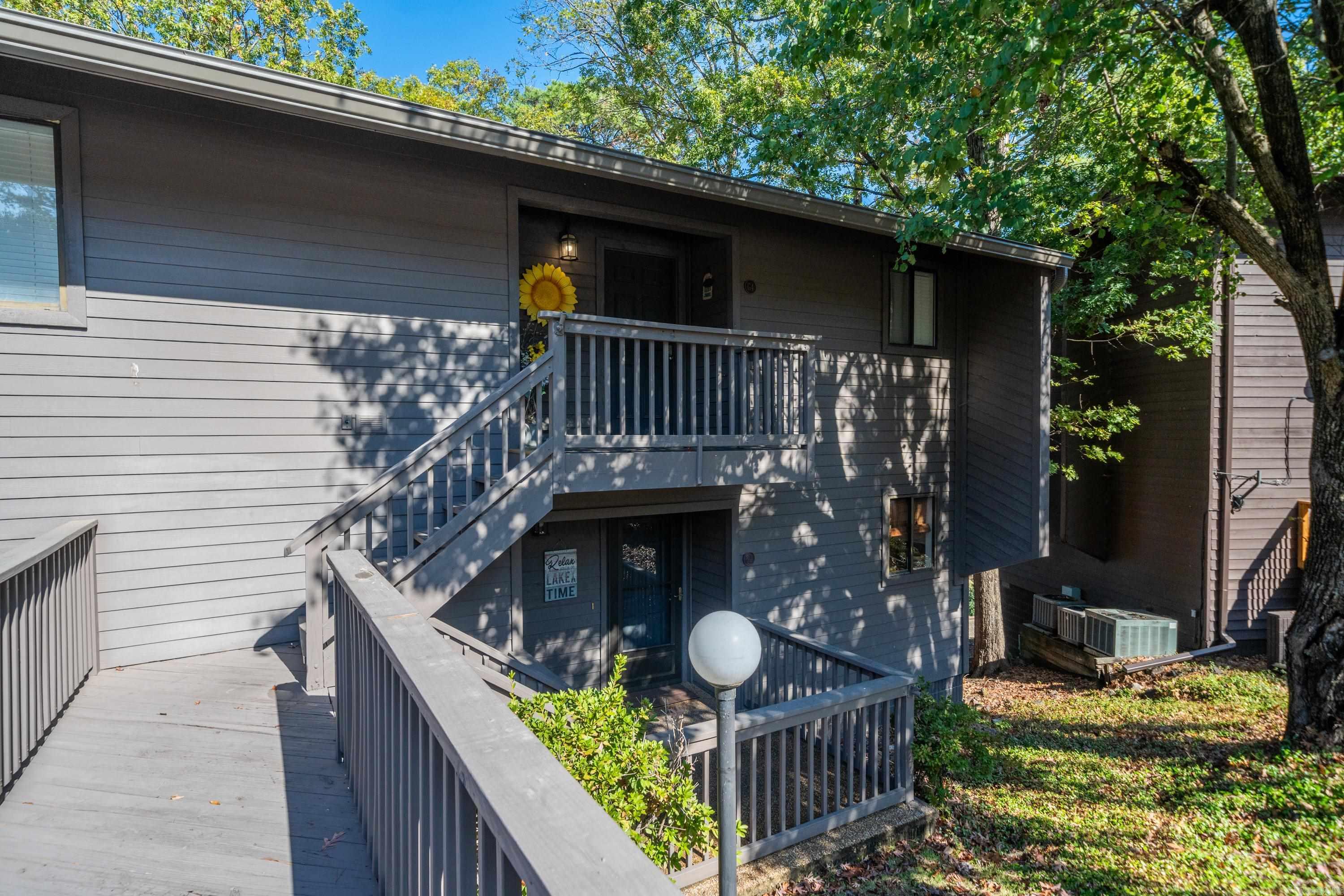 Welcome to this charming 2-bedroom, 2-bathroom condo located in the desirable Hamilton Oaks community in Hot Springs, Arkansas. This fully furnished condo offers the perfect blend of comfort, convenience, and leisure, making it an ideal choice for both full-time residents and vacationers alike. Key Features: 2 Bedrooms, 2 Bathrooms: Spacious and inviting, the two bedrooms provide ample space for relaxation, while the two bathrooms offer modern fixtures and convenience. Fully Furnished: Move-in ready with stylish, comfortable furniture and decor throughout. Just bring your suitcase! Boat Dock & Boat Lift: Enjoy direct access to Lake Hamilton with your very own boat dock and boat lift, making it easy to spend days on the water. Activities: The community features well-maintained tennis courts and swimming pools, perfect for a relaxing day in the sun or a cool dip during the summer months. Nightly Rentals Allowed: The property allows for nightly rentals, offering an excellent investment opportunity for those looking to generate rental income. Prime Location: Located in the heart of Hot Springs, you'll be close to local restaurants, shopping, and attractions.