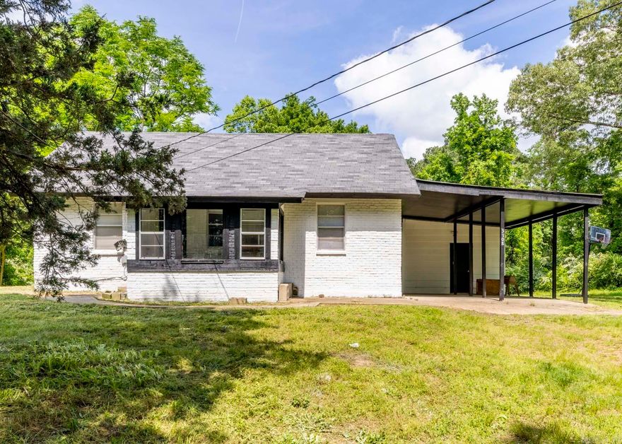 Welcome to this charming 2 bedroom, 1 bath home in Bauxite with 1.08 acres! Great investment property! Fresh paint throughout! Spacious living room with original hardwood flooring. Laminate in bedrooms. The bathroom features a tiled shower/tub combo and tile flooring. Covered 2 car carport with large storage room. Nice enclosed sunroom! Bauxite schools!