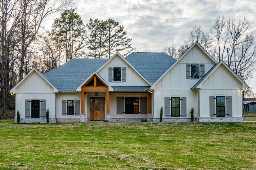 Brand new construction on 1.53 acres with Lake Hamilton access, directly across from the neighborhood boat ramp! This beautiful home features arched doorways, vaulted ceilings, and an open floorpan perfect for entertaining. The kitchen is a chef's dream with 36" gas stove, custom cabinetry, and ample counter space. Includes a large laundry room, butler's pantry, and extra storage room in the garage. Upstairs offers a spacious bonus room with a reading nook and full bath. Brick and board and batten exterior complete this stunning home! Call today!