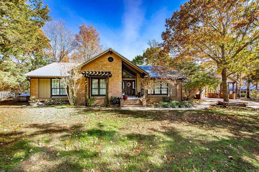 WELCOME to a Truly One-of-a-Kind Mountain Retreat! This cozy custom-built home offers the perfect blend of privacy, comfort & natural beauty. Tucked away on a no-outlet street, just outside of the city limits, the home is beautifully positioned atop a gentle ridge, offering year-round long-range mountain views. Inside, you'll find beautiful craftsmanship throughout w/3 bedrooms & 2.5 full bathrooms, an expansive open-concept living w/ a stately fireplace & open kitchen area that offers quartz countertops, custom cabinetry, & direct access to a sprawling covered back deck—perfect for entertaining or simply soaking in the scenery. The spacious master suite features a private sun room, walk-in shower, an oversized soaker tub , two walk-in closets. Includes a whole house generator, spacious 24x36 workshop, 8x14 storm shelter & a large RV shed. Don’t miss the quaint little tree-house cabin out back. You’ll have plenty of room to roam, garden, relax & enjoy the sights and sounds of nature here. A home office would be ideal considering you have Fiber Optic Internet! Furniture is negotiable. This home has so much to offer. Call me today!