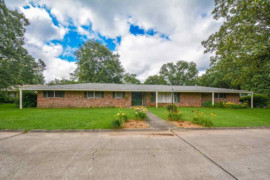 Endless possibilities in this super spacious ranch-style home! Located in Midtown's Briarwood neighborhood on level, corner lot, this home has 3 large bedrooms & 2.5 baths in main house and converted workshop is nanny/man-cave with full bath & separate entrance off carport. Entertain in sprawling formal living/dining room, spill over to spacious family room w fireplace. Giant closets, abundant storage, original marble bathroom vanities, patio oasis, 3-car carport, outdoor storage unit.