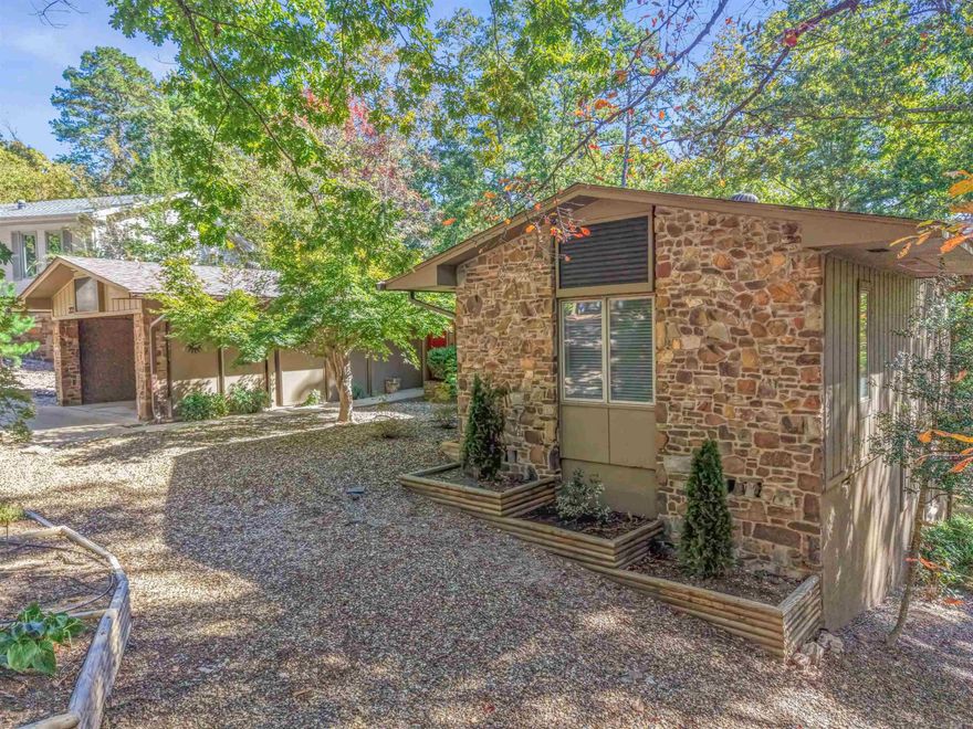 Prepare to be impressed! This meticulously updated 2 bed, 2 bath home is ready for its new owner. Enjoy peace of mind with all major updates complete, including a 2023 Heat Pump, 2023 Water Heater, and a 2024 Roof. The interior shines with a fresh, contemporary look, featuring all new floors, interior doors, and fresh paint throughout. The kitchen is completely updated and connects seamlessly to a bright Sunroom, making it perfect for relaxing or entertaining.  This property is a hobbyist's dream, offering an incredible amount of dedicated space. You'll find a separate heated/cooled workshop and an additional heated/cooled flex room perfect for a home office, storage, or craft area. There is also a detached workshop/she-shed and an extra storage room. Outside, you can enjoy the fresh air on the all-new multi-level deck which overlooks a gently sloping backyard. A dedicated gravel parking area on the side provides convenience for your trailer or golf cart.  Conveniently located near West Gate, this home combines modern updates with fantastic functionality and a prime location. Don't miss the opportunity to make this spectacular property yours! New Member Buy In Fee due at closing.