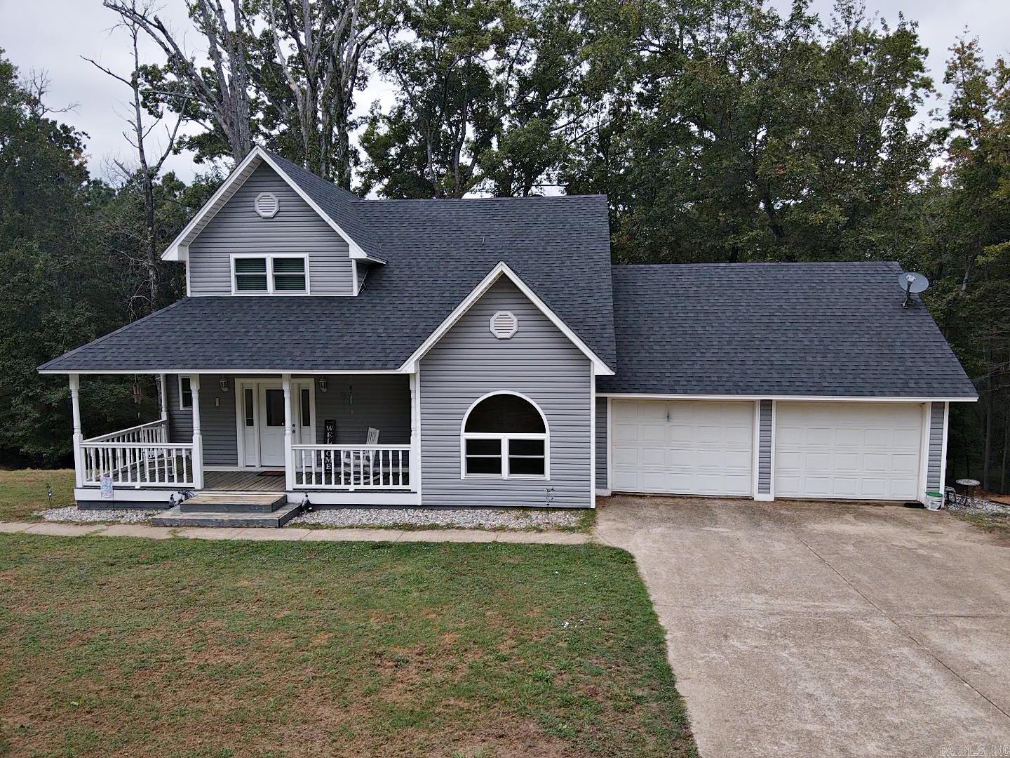 CUSTOM BUILT3 BR/2 BA home sitting on 3.07 Acres with energy efficient upgrades, plus 2 car garage, shop, and storage for boat or camper. Spacious kitchen with lots of cabinets and counter space, plus pantry. Den/Living Area has electric FP with built-ins on each side. Hardwood floors downstairs, carpet upstairs. One BR downstairs. 2 Bedrooms upstairs including the beautiful primary suite w/2 walk-in closets and massive bathroom. Deck across the back to enjoy the peaceful private shaded lot while watching the deer and squirrels play. Solar panels keep the electric bill to a minimum plus all new windows. Call to see this beautiful home today.