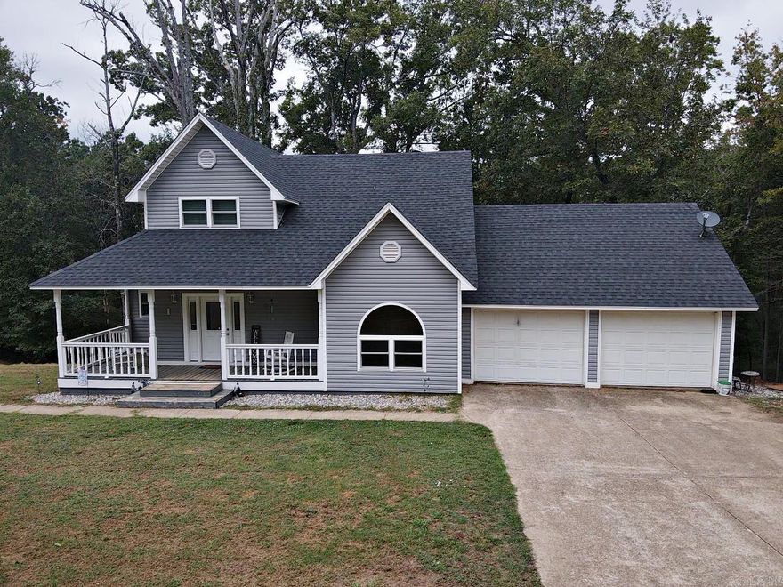 CUSTOM BUILT3 BR/2 BA home sitting on 3.07 Acres with energy efficient upgrades, plus 2 car garage, shop, and storage for boat or camper. Spacious kitchen with lots of cabinets and counter space, plus pantry. Den/Living Area has electric FP with built-ins on each side. Hardwood floors downstairs, carpet upstairs. One BR downstairs. 2 Bedrooms upstairs including the beautiful primary suite w/2 walk-in closets and massive bathroom. Deck across the back to enjoy the peaceful private shaded lot while watching the deer and squirrels play. Solar panels keep the electric bill to a minimum plus all new windows. Call to see this beautiful home today.
