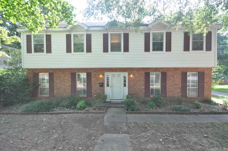 Wonderful home with 4 spacious bedrooms 2 full baths and 1 half.  Formal dining with beautiful hardwood floors.  Kitchen/breakfast combo has tile floors and counter, plenty of cabinet space and a pantry. Sink has window over it to enjoy looking outdoors. formal living, lg den with fireplace. Great outdoor living with a screened in deck and additional decking 2 car carport with add'l parking. Close to shopping, schools and all the conveniences. Lots of storage.