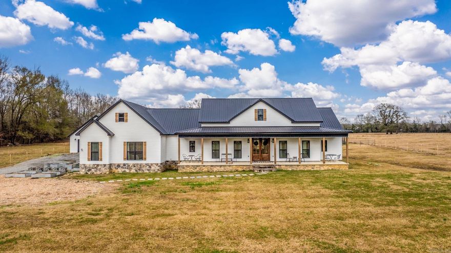 Stunning Home + Guest House on 5 Acres.  Beautifully built in 2021, this 2,784 sq ft main house offers 4 bedrooms and 2 bathrooms. The kitchen, dining room and living room are a 1000 sq ft space with a fireplace. The Gourmet kitchen consist of two islands with granite countertops, 48'' gas cooktop with a griddle and an  oversized pantry.  The 740 sq ft guest house includes 1 bedroom, 1 bathroom, a safe room, and an attached garage.  Both houses have screened porches, tankless hot water heaters and their own septic tank.  There is a chicken coop any chicken would love, bring your horses and cows and come check out this amazing property.