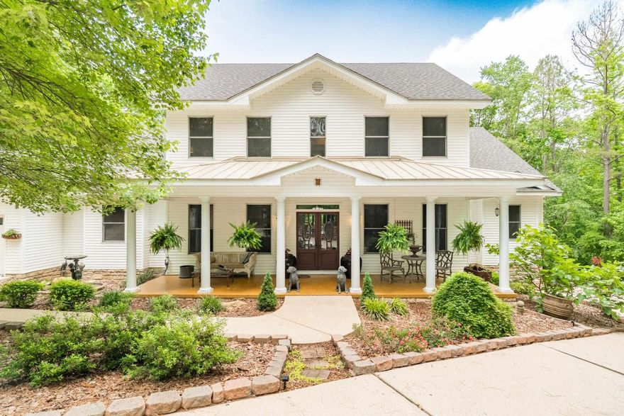 Southern Elegance Meets Modern Comfort- Step onto the sweeping front porch—perfect for relaxing or catching up with friends. Enter the foyer through antique double leaded-glass doors and feel instantly at home. This home features generously sized rooms including a formal dining room comfortably fits a 12-person table. A cozy living room invites quiet conversation or serves as an office. The family room opens to mountain and forest views, flows into a chef’s dream kitchen—professional-grade stove, double ovens, warming drawer, pot filler, open shelving, copper farmhouse sink, oversized pantry, and butler’s pantry. Enjoy indoor-outdoor living: the breakfast room connects to a screened porch, while the deck with hot tub flows from the family room. The primary suite includes a spa bath - double vanities, soaking tub, walk-in shower, and dual walk-in closets. A half bath and laundry room complete the main floor. Upstairs offers two baths and four versatile bedrooms—each with walk-in closets—currently used as guest room, office, exercise, and craft room. Downstairs includes two garage bays, workshop/golf cart parking. All set on a beautifully landscaped 3/4 acre lot. Central vac.