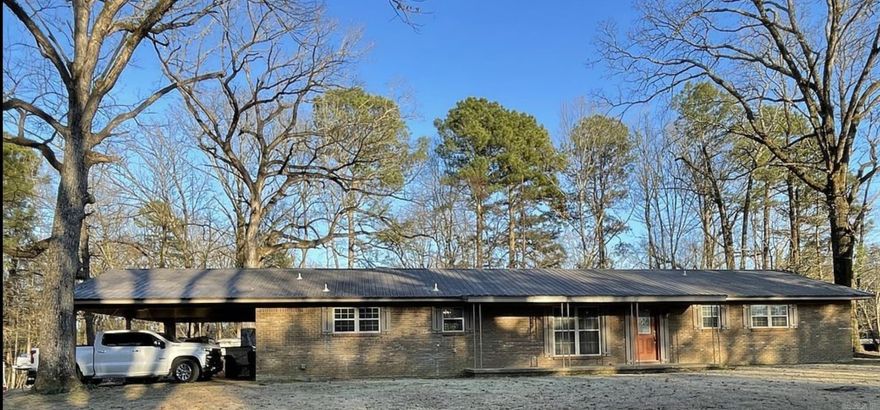 Quiet country living with large trees and open field.  Watch wildlife from your living room. This home has an OPEN FLOOR PLAN which is great for everyday living and especially family gatherings. The plan includes the kitchen, living room and dining room. The Large Laundry/Mud Room can be used for a variety of things due to the size. In addition to the closets in the bedrooms, pantry and bathroom, there are two closets in the hallway.  There is a wheelchair ramp leading the carport doors for easy access, but the ramp can be removed easily.  SPECIAL NOTE: The Generac Home Generator is a blessing during power outages.