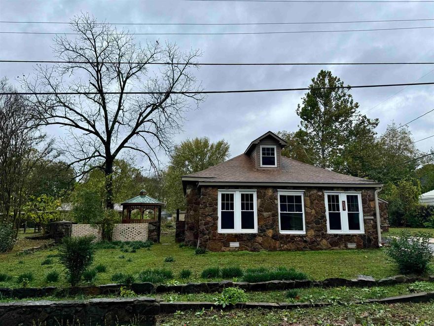 This charming historical home is a must see! Original built-ins, several original doors and hardware, and original wood burning fireplace retain this home's vintage charm, while some newer updates including fresh paint throughout bring a bright and fresh feel. The roof, windows, and plumbing have all been replaced within the last 10 years further enhancing the home’s long-term durability. This home offers spacious bedrooms with many other rooms, providing endless possibilities; including a bonus room upstairs! Outside of the home, you will find a double insulated shop, and a gazebo perfect for relaxing with friends and family! Ideal for someone who values a blend of history and modern convenience, this home is a true find! *photos were taken with a slide wide angle to allow full view of each space. The floor plans are estimated and may not be completely accurate.* See agent remarks
