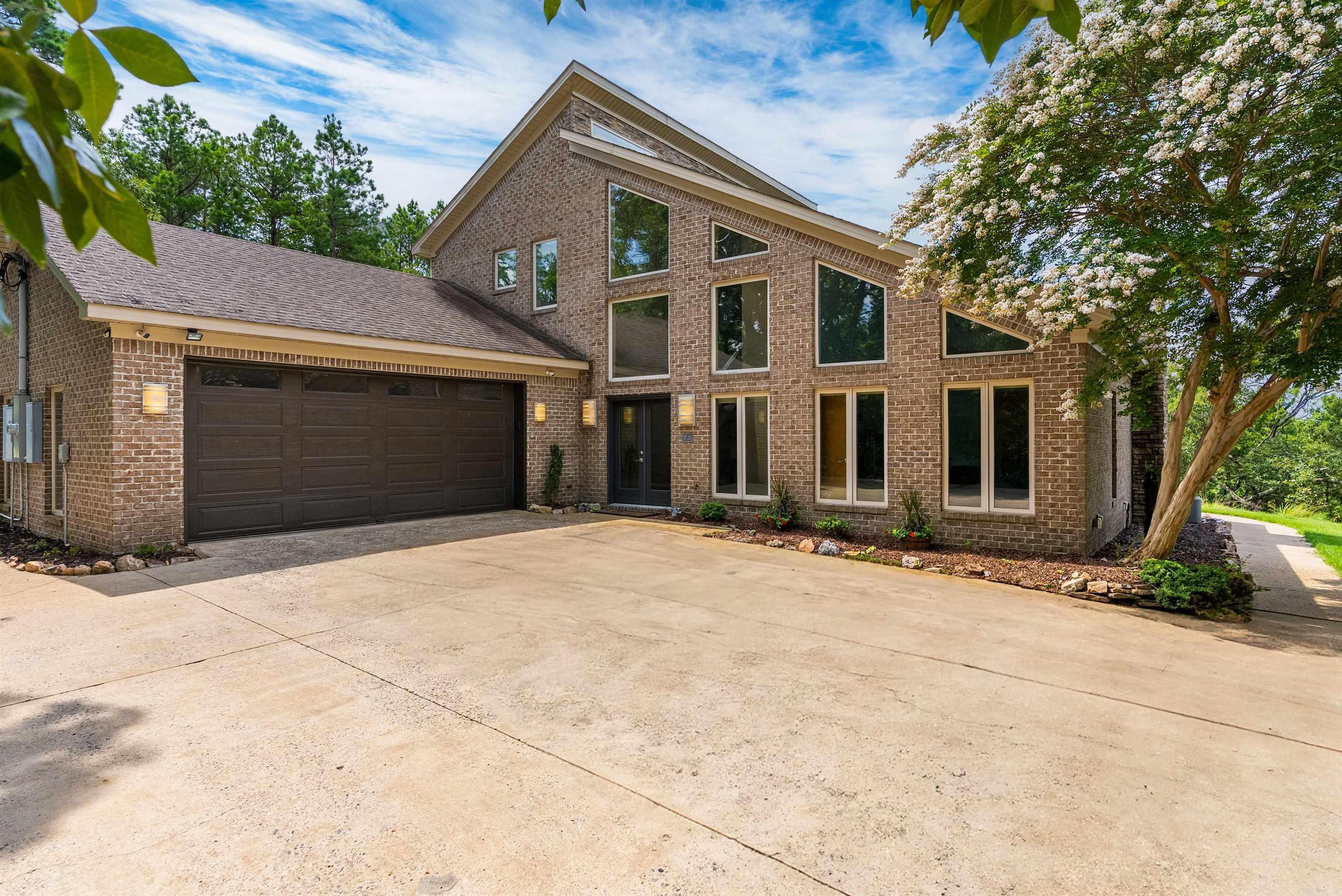 This beautifully maintained home offers breathtaking views of the Ouachita Mountains from an expansive, oversized deckāperfect for relaxing or entertaining. Inside, enjoy abundant natural light streaming through expansive insulated windows, complete with electronic shades for convenience and comfort. The spacious living area features a cozy woodburning fireplace and opens to the incredible mountain vistas, creating a warm and inviting atmosphere. Gorgeous wood floors run through the common areas, enhancing the home's timeless charm. The main level includes a generous primary suite and a comfortable guest bedroom. A custom staircase leads to the upper level, where youāll find a third bedroom, a full bath, and a versatile loft office spaceāideal for remote work or a creative studio. Additional features include ample storage throughout, large closets, a two-car garage, and an exterior storage building for extra flexibility. This home offers a rare blend of comfort, design, and breathtaking scenery. Donāt miss this opportunity to own a piece of mountain-view paradise! See agent remarks...