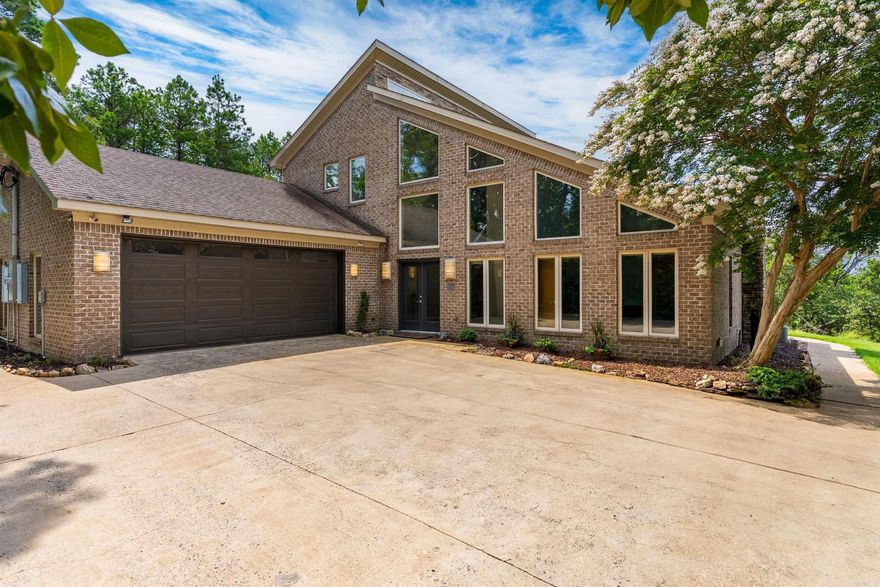 This beautifully maintained home offers breathtaking views of the Ouachita Mountains from an expansive, oversized deck—perfect for relaxing or entertaining. Inside, enjoy abundant natural light streaming through expansive insulated windows, complete with electronic shades for convenience and comfort. The spacious living area features a cozy woodburning fireplace and opens to the incredible mountain vistas, creating a warm and inviting atmosphere. Gorgeous wood floors run through the common areas, enhancing the home's timeless charm. The main level includes a generous primary suite and a comfortable guest bedroom. A custom staircase leads to the upper level, where you’ll find a third bedroom, a full bath, and a versatile loft office space—ideal for remote work or a creative studio. Additional features include ample storage throughout, large closets, a two-car garage, and an exterior storage building for extra flexibility.  This home offers a rare blend of comfort, design, and breathtaking scenery. Don’t miss this opportunity to own a piece of mountain-view paradise! See agent remarks...