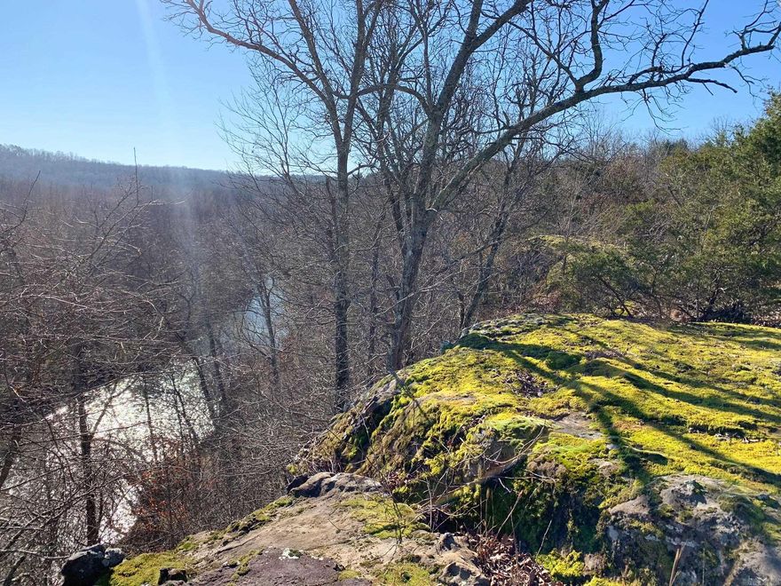 Build your getaway cabin overlooking a breath-taking view of the Cadron Creek valley, nestled amongst the gateway to the Ozarks. This 10-acre tract runs all the way back to the center of the gorgeous, year-round North Fork of the Cadron Creek. Rock bluffs jut out above the creek and make for amazing views across the creek valley. Rock shelfs and shelters dot the hillside. This tract has lots of wildlife and is peaceful and secluded -- almost entirely surrounded by other wooded tracts and with access from a quiet dead-end county road. This is the perfect place for a private residence, getaway cabin, off-grid build, hiking,  fishing... you name it! Electric and water are available along Odom Point Rd. Only a 20-minute drive to Choctaw Marina on Greers Ferry Lake and one hour from Grinder's Ferry on the Buffalo National River. There are a total of 30 acres available at this location. Buyer can choose which 10 acres to purchase depending on what is still available or may choose to purchase more than 10 acres if available. No mobile homes allowed.
