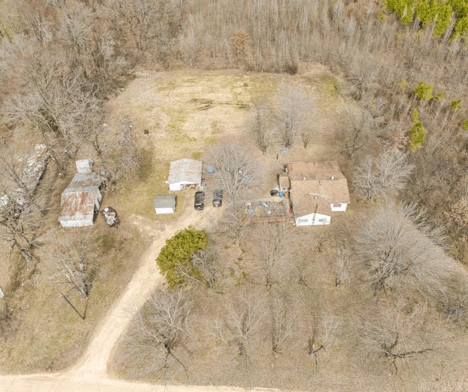 5-Acre Country Retreat with Endless Possibilities! Nestled on 5 beautiful acres, this 3-bedroom, 1-bath home is full of potential! The home features a cozy sunroom and plenty of space to make it your own. Several outbuildings and a barn provide excellent storage or workspace options. Additionally, the property includes a second septic system from a previous home site-offering exciting possibilities for expansion or a second dwelling. Whether you're looking for a peaceful retreat, a mini-farm, or a place to build your dream homestead, this property is ready for your vision. Don't miss this opportunity. Schedule a showing today! Home to be sold as-is and seller will make no repairs.