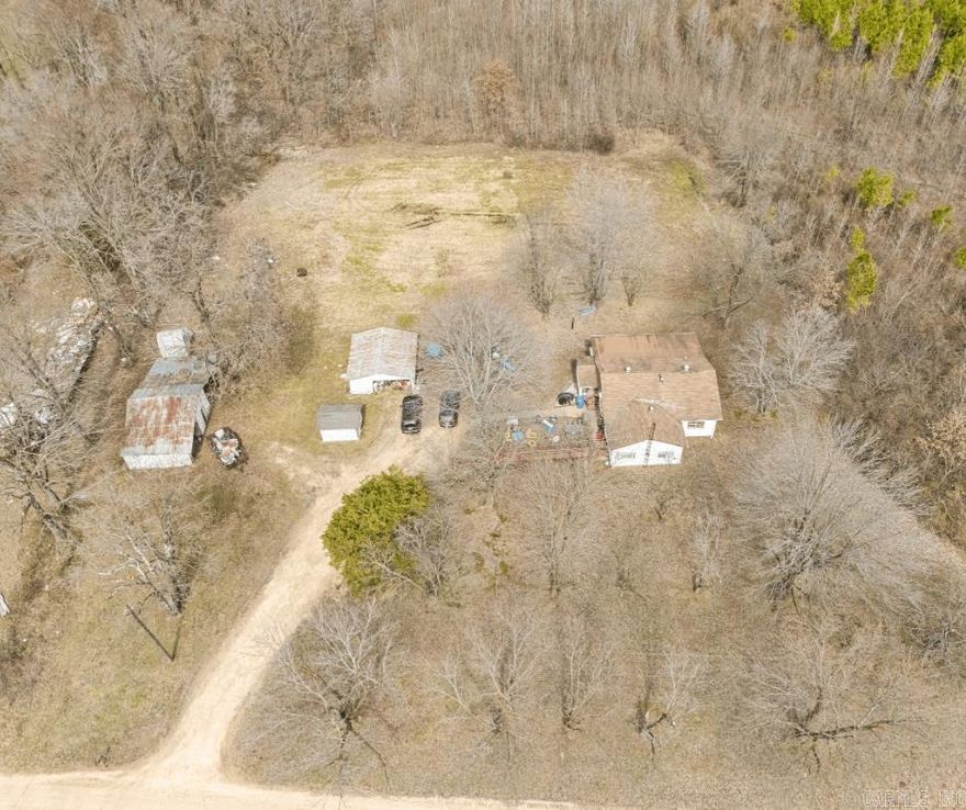 5-Acre Country Retreat with Endless Possibilities!    Nestled on 5 beautiful acres, this 3-bedroom, 1-bath home is full of potential! The home features a cozy sunroom and plenty of space to make it your own. Several outbuildings and a barn provide excellent storage or workspace options. Additionally, the property includes a second septic system from a previous home site-offering exciting possibilities for expansion or a second dwelling. Whether you're looking for a peaceful retreat, a mini-farm, or a place to build your dream homestead, this property is ready for your vision. Don't miss this opportunity. Schedule a showing today! Home to be sold as-is and seller will make no repairs.