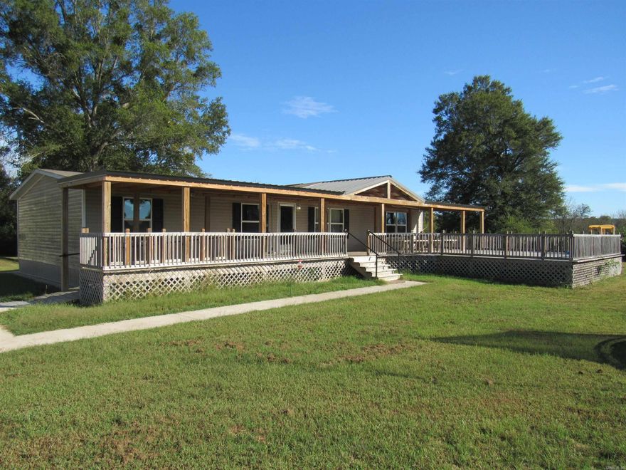 Country Home Rental Escape to spacious county living in this fantastic 3 Bedroom, 2 Bathroom double-wide mobile home that features two separate living rooms, a dining room, and a dedicated laundry room; for your convenience, it includes a washer, dryer, and refrigerator. Outdoors, you can relax on either the covered front porch or the back porch, and you'll find unmatched storage and utility space in the huge 35' x 25' shop with two roll-up doors, an extra fridge, and a deep freezer, plus there is a pond on the property perfect for fishing or relaxing around. If you are looking for peaceful country living with incredible amenities, call today for your application!  (Note: Tenant must obtain a $100,000 liability insurance policy for the unit, available through us for $12/month or a third party.)