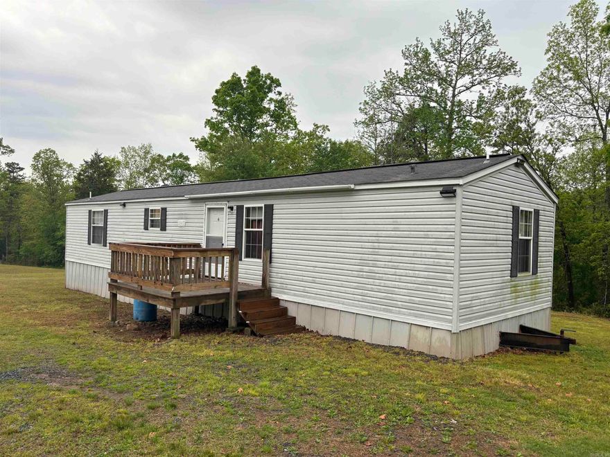 Nice 2 bedroom 2 bath mobile with outside storage and 2.34 acres. New carpet and large MBR . Large decks.  Make a great starter home.