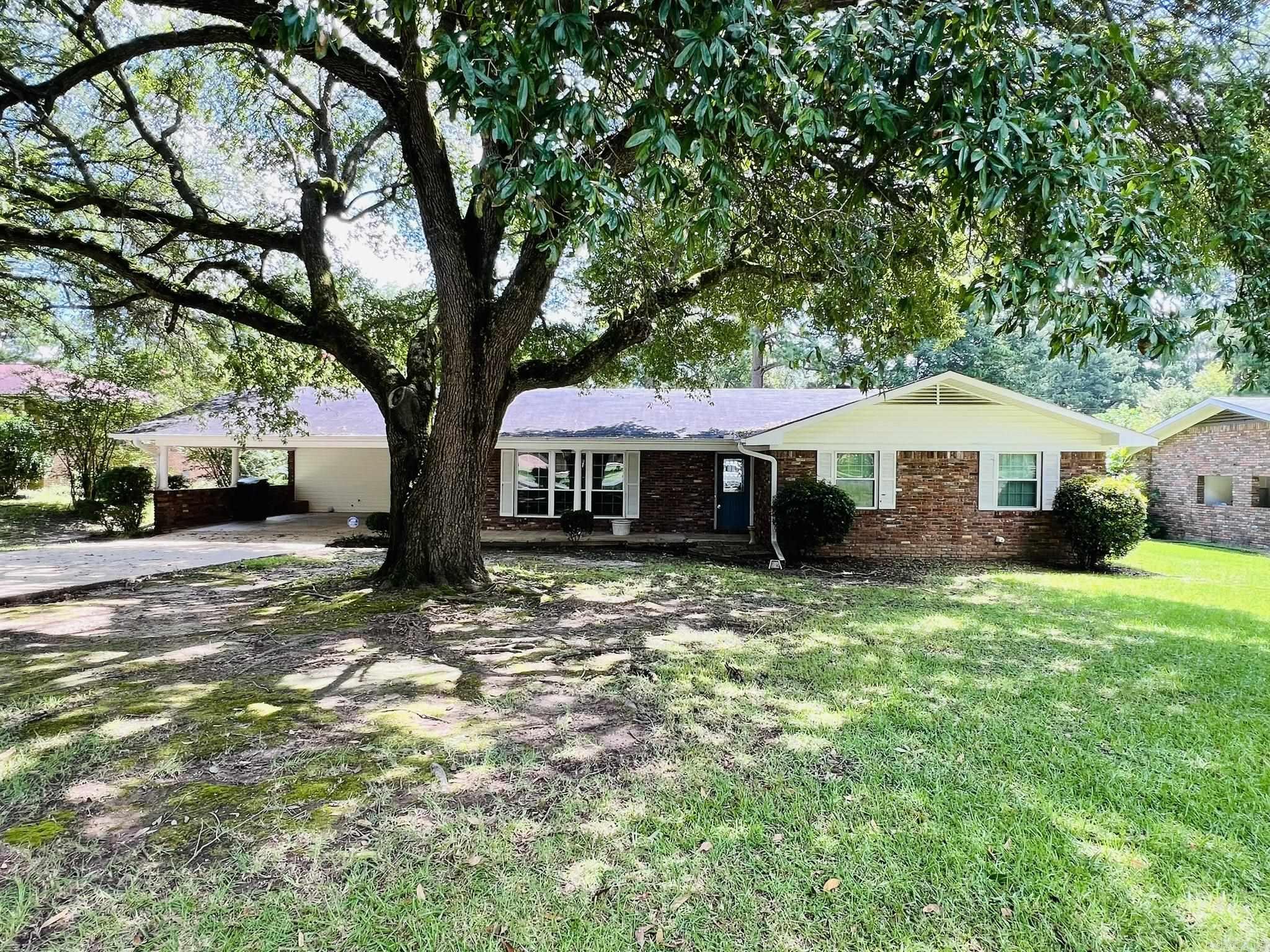 **Charming Brick Ranch in the Berg Addition** Welcome to this inviting 3-bedroom, 2-bathroom brick ranch home nestled in the desirable Berg Addition. This residence boasts a formal living and dining area, perfect for entertaining or cozy family dinners. The heart of the home is the spacious den, featuring a wood-burning fireplace, which seamlessly flows into the kitchen. The kitchen is well-appointed with a wall oven, electric cooktop, dishwasher and cabinets with convenient pull-out drawers. Enjoy the bright and airy sunroom just off the den, offering a serene space for relaxation or hobbies. The home also includes vinyl windows, ensuring energy efficiency and easy maintenance. Step outside to the fenced backyard, ideal for outdoor activities or pets, and a covered concrete patio that leads to a storage room. A 10x14 storage building provides additional space for your tools or equipment. Don't miss the opportunity to make this charming home your own! Contact us today to schedule a showing.
