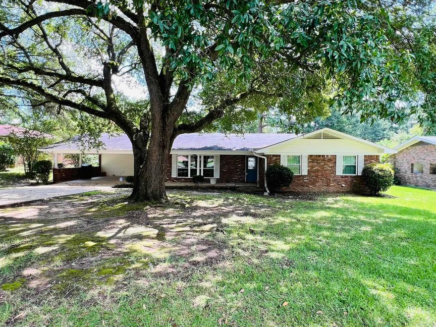 **Charming Brick Ranch in the Berg Addition**  Welcome to this inviting 3-bedroom, 2-bathroom brick ranch home nestled in the desirable Berg Addition. This residence boasts a formal living and dining area, perfect for entertaining or cozy family dinners. The heart of the home is the spacious den, featuring a wood-burning fireplace, which seamlessly flows into the kitchen. The kitchen is well-appointed with a wall oven, electric cooktop, dishwasher and cabinets with convenient pull-out drawers.   Enjoy the bright and airy sunroom just off the den, offering a serene space for relaxation or hobbies. The home also includes vinyl windows, ensuring energy efficiency and easy maintenance.  Step outside to the fenced backyard, ideal for outdoor activities or pets, and a covered concrete patio that leads to a storage room. A 10x14 storage building provides additional space for your tools or equipment.  Don't miss the opportunity to make this charming home your own! Contact us today to schedule a showing.