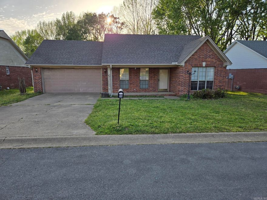 Nice 3 bed, 2 bath brick house with 2 car garage with split floorplan that backs up to vacant land & trees in the back. This house was built in 1997 on a slab & has a large patio in back as well as gutters. Spacious living room with vaulted ceiling that opens up to dining room. Hardwood floors in living room, hall & 2 bedrooms. Tile floors in kitchen, dining, both baths & separate laundry room. Master bedroom has a walk-in closet & tray ceiling. Refrigerator stays.