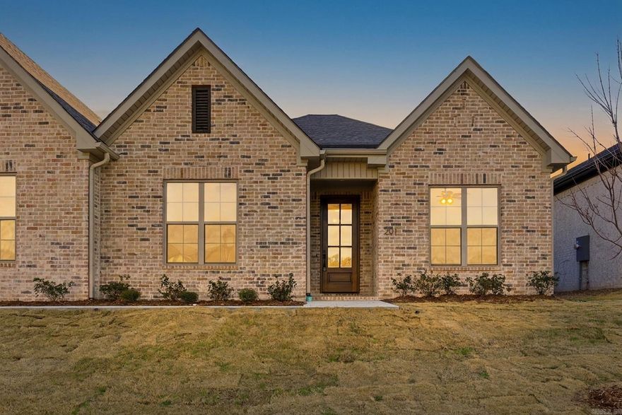 Welcome home to West Little Rock’s newest destination for luxury living, Edgewood. Surrounded by lush landscaping & mature trees, this community offers a private, tucked-away feel just minutes from premier shopping and dining. And one of the best perks? Never mow your lawn again. Lawn maintenance is included with your yearly fees!  This stunning attached home features an open concept layout with thoughtfully curated designer finishes throughout. The chef’s kitchen showcases a large center island that flows seamlessly into a spacious living area with fireplace. Each residence is separated by fire walls with sound cavities, creating a quiet, private environment designed for comfort. The oversized back porch offers the perfect place to unwind or entertain overlooking a private back lawn.  Currently under construction with an anticipated completion and move-in timeline of September 2026. Buyers who go under contract within the next 30 days will have the opportunity to participate in the interior selection process, allowing for a more personalized, design-forward finish. Photos are of a similar floor plan and are for reference purposes only. Finishes, features, and selections may vary.