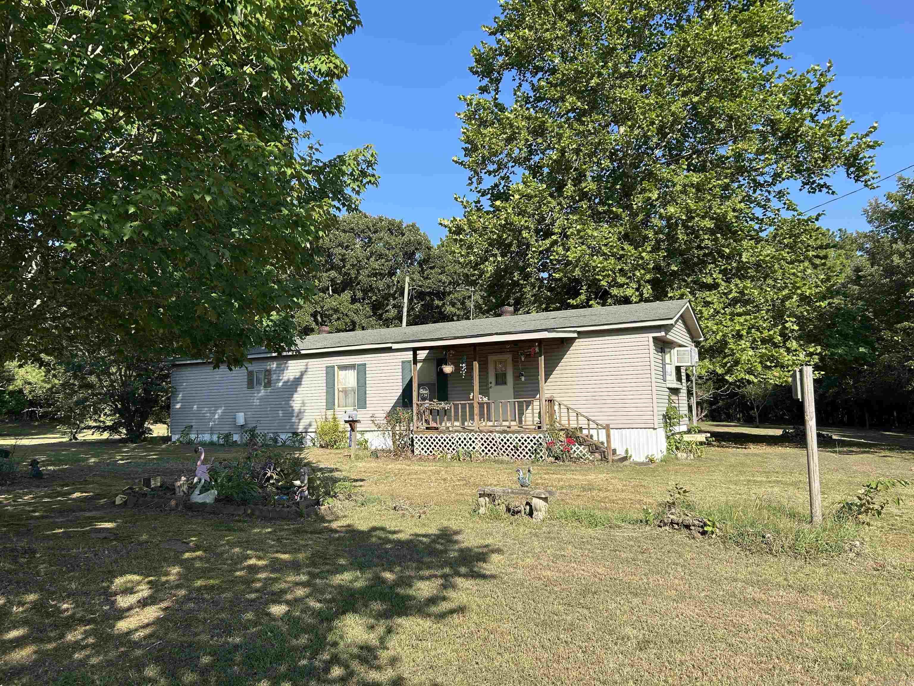 NO RESTRICTIONS on almost 2 acres with a partially fenced in area for some animals in town, lets make this place yours . Location is perfect and its close to all the stores and just minutes from the lake. Call today !!