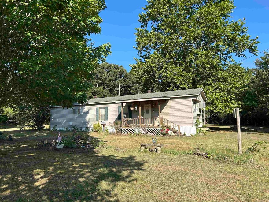 NO RESTRICTIONS on almost 2 acres with a partially fenced in area for some animals in town, lets make this place yours . Location is perfect and its close to all the stores and just minutes from the lake. Call today !!