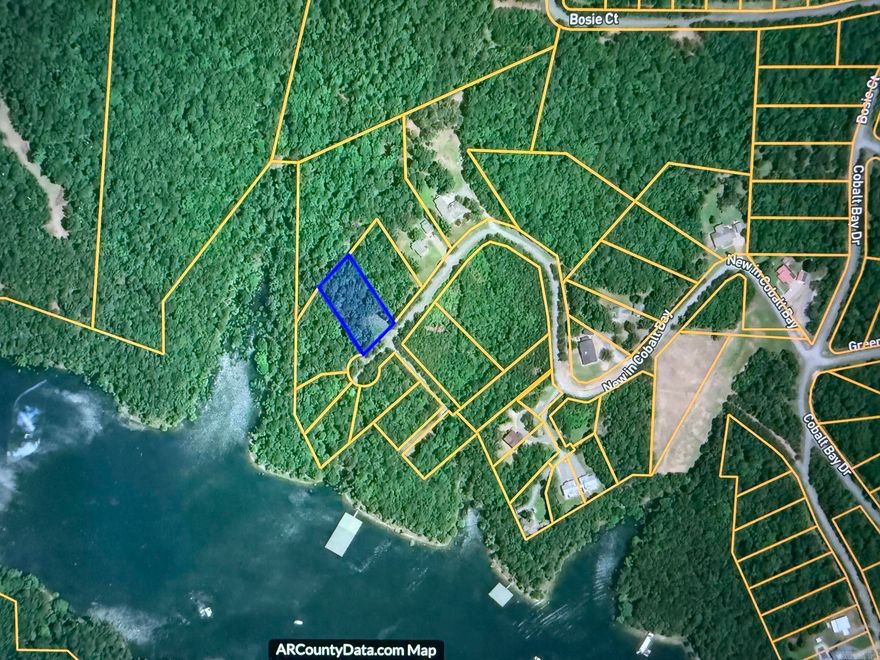 TWO BOAT SLIPS! come with this beautiful hillside lot in a very private lakeside community.  Just uplake from Fairfield Bay on the South Fork of Greers Ferry Lake.  Plan your dream vacation or retirement home while enjoying the convenience of two private slips in a small, community dock.