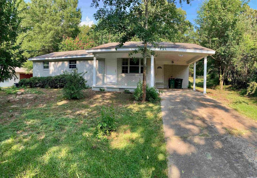 This house has everything! It has a gorgeous kitchen, lots of space, and a large back yard as well as a carport.