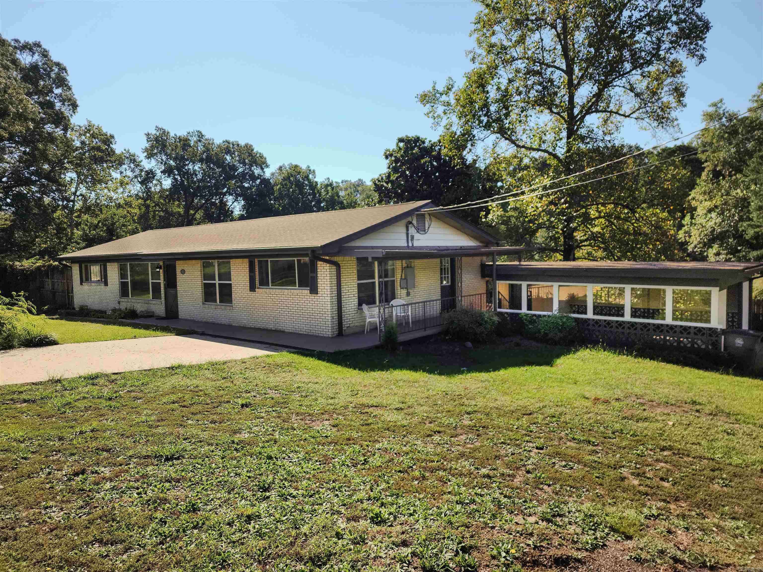 This beautifully remodeled ,move-in-ready home has been freshly renovated with new paint and a mix of refinished and new floors. Sitting on a corner lot, it boasts incredible views of the Hot Springs Mountain observation tower. Features include a carport, extra parking pad, spacious privacy-fenced backyard, and a deck perfect for relaxing or entertaining. Close to everything.