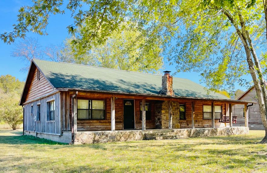 LOG CABIN IN THE HEART OF THE OZARK MOUNTAINS  Embrace the Ozark Mountains in this exquisite 3 bed, 2 bath log siding home. Immerse yourself in the rustic elegance of the cabin’s design, featuring cozy interiors and a spacious deck to soak in the surrounding beauty.  This home is half a mile from Anglers Restaurant, six miles to Loco Ropes, and only seven miles from the square in Mountain View.  Mountain View also features Blanchard Springs Caverns. Explore all that Mountain View has to offer here: Mountain View, AR  Whether you are looking for a weekend getaway or a potential income producing home, this has it all! Listed for $175,000! The seller is offering owner-financing with 20 percent down. There is a $1000 buyer’s agent bonus. Contact the listing agent for more details.