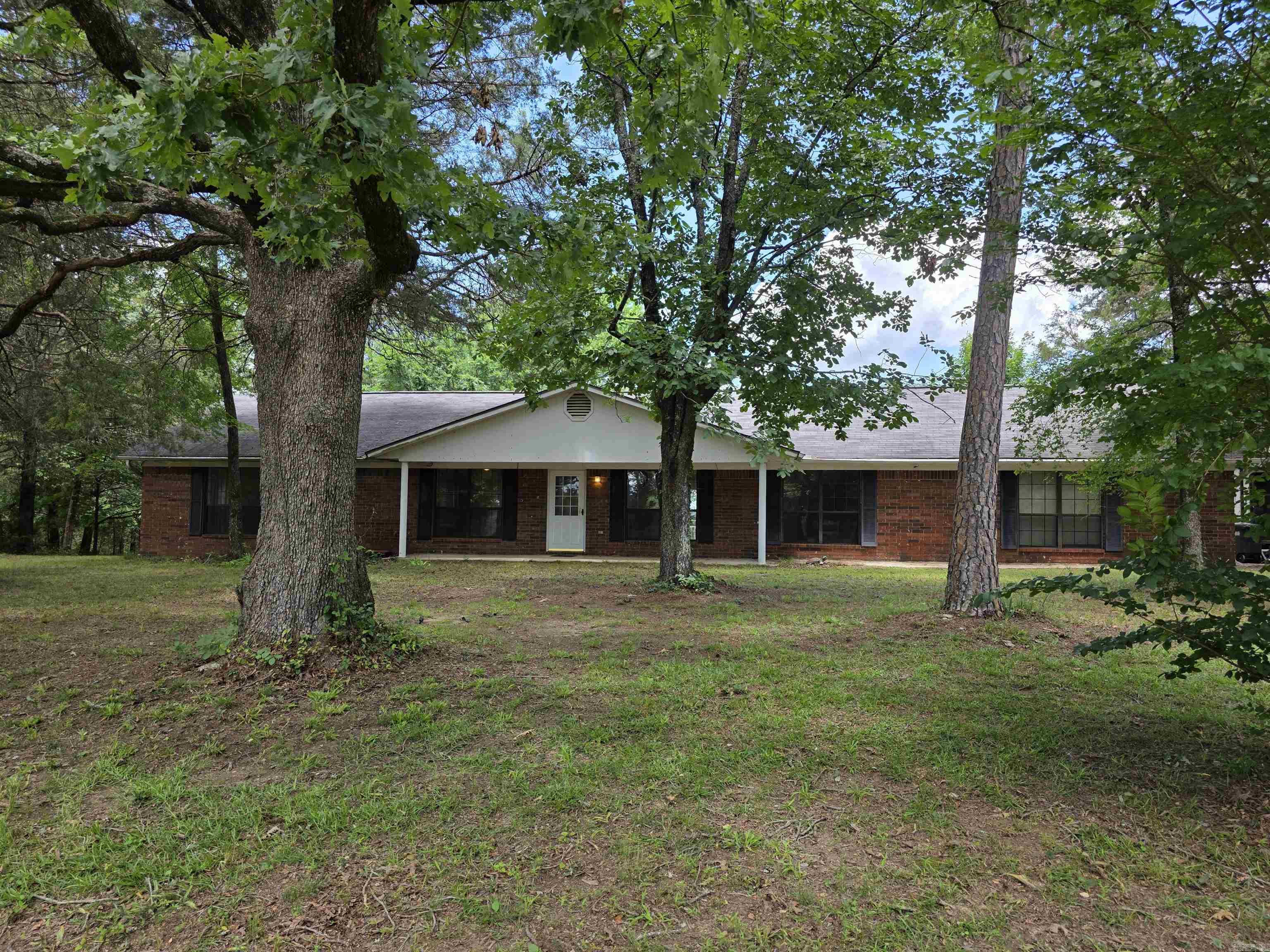 Hard to find 4 bedroom/2 bath brick home on Crow Mountain with 2.73 acres. It is a double lot. Deer feed out back. Enjoy the wood burning fireplace during fall and winter and the back deck and covered front porch during spring and summer. The kitchen offers bar seating and there is a separate dining room. Both are open to the living room. Refrigerator, washer, and dryer convey. There are also 2 outbuildings that convey.