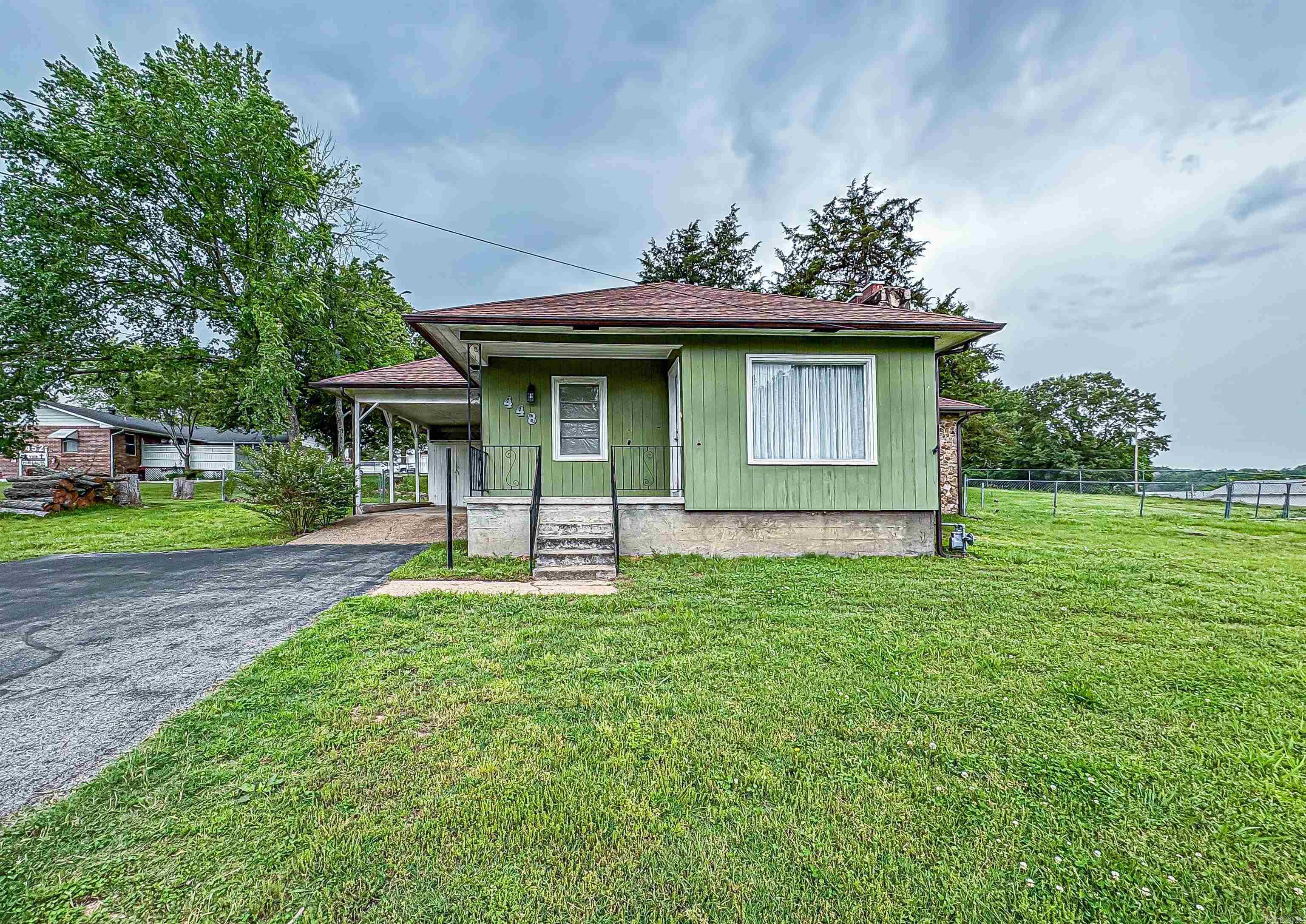 Check out this lovely home on ½ acre just on the edge of the beautiful, quiet, little town of Yellville! Many updates have been made to this charming home in the past few months. There is a large fenced in backyard for your pups, and a 16x20 shop/outbuilding out back. It is within walking distance from public access on Crooked Creek and the city park which has walking trails, a splash pad and many other amenities. It is centrally located from Buffalo River, White River, and Bull Shoals Lake, each being only 20 minutes away!