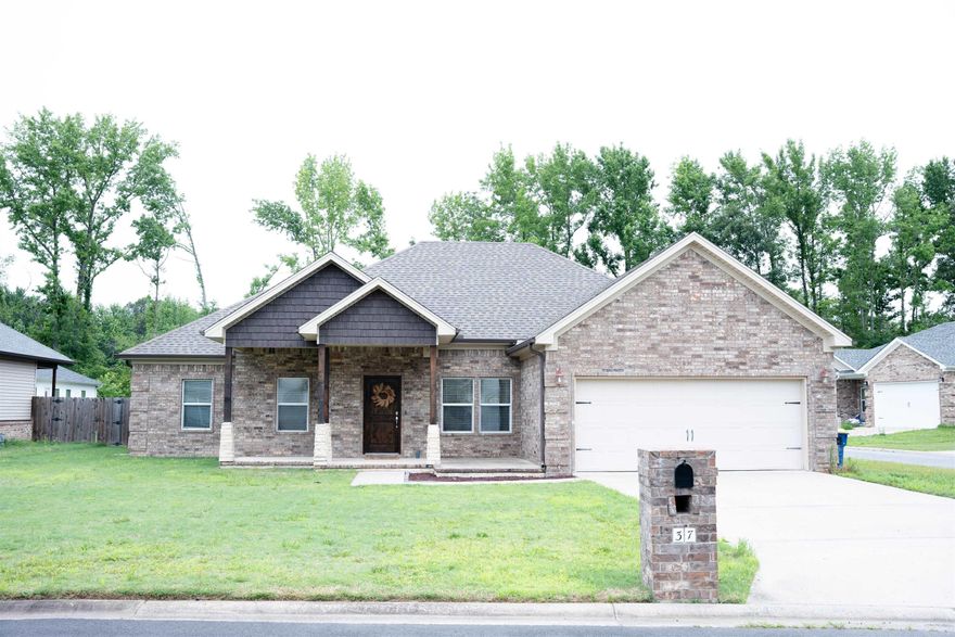 Welcome to this incredible 4 bedroom, 2 bath home with a world of potential! This property boasts an open living space, high ceilings, and beautiful hand-scraped wood tile throughout. The kitchen is a chef's dream with granite countertops and stainless steel appliances. The master bedroom offers ample space, a large closet, and a luxurious oversized custom shower in the master bathroom. You'll also enjoy the charming covered front porch and the screened-in rear porch with an additional patio area. This home is just waiting for your personal touch to make it truly shine. Don't miss out on this amazing opportunity to create your dream space!