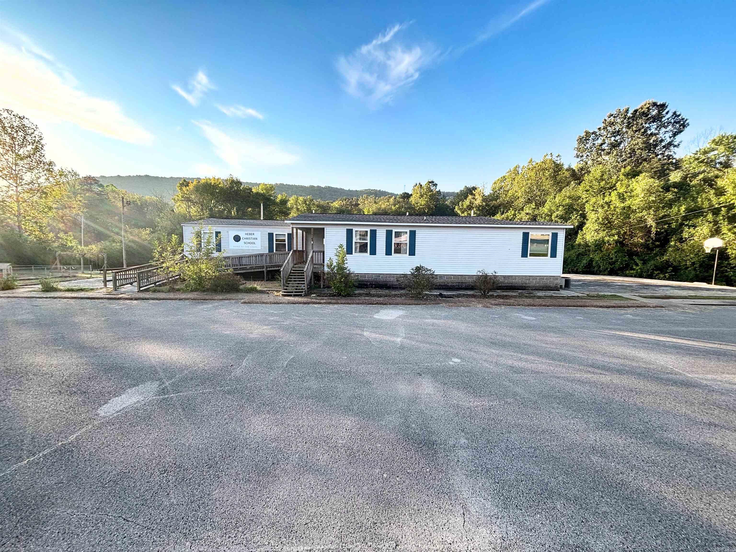 This building has plenty of space and outdoor area for your business needs! New roof in 2024. 4 rooms with 3 bathrooms and a kitchen, sellers believe the approximate square footage to be 2200. agents see remarks.. Year built is unknown