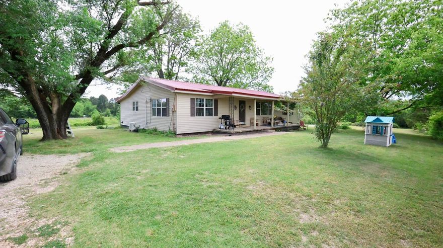 Country Home for Sale in Arkansas! Located at 337 Cooper Hollow Road in Mount Pleasant, Arkansas, this remodeled 3 bedroom, 1.5 bathroom home offers 1,926 square feet of living space on 2.97 acres in scenic North Central Arkansas. This property combines comfortable living space with acreage, making it ideal for buyers looking for a country home with land in the Ozark Mountains.  This property features a fully remodeled interior with multiple updates and improvements throughout, creating a move-in ready home with modern appeal and long-term value. The big open space and big windows provides functional living space, with a new mini split system for heating and cooling, offering efficient climate control. The 2.97 acres provide space for outdoor enjoyment, gardening, or small hobby use while still being easy to maintain. Enjoy the country life amidst a fruitful orchard, consisting of 6 apple trees, 2 peach trees, 3 pear trees, 2 pecan trees, and abundant blackberry vines. Price to sell at $189,000