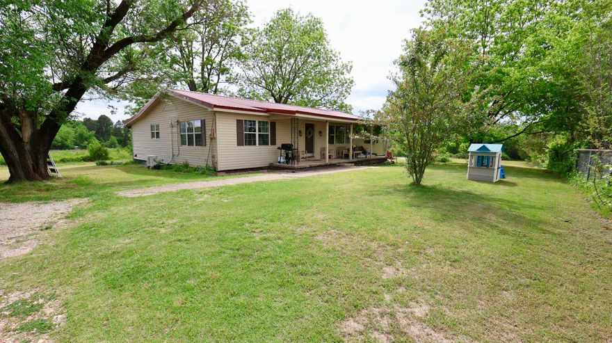 This remodeled 3 bedroom, 1.5 bathroom home offers 1,926 square feet of living space on 2.97 acres in scenic Mount Pleasant, Arkansas.  The interior features numerous improvements throughout, with open living spaces and large windows that create a bright, inviting atmosphere and move-in ready appeal.  Heating and cooling are provided by a new mini-split system, with additional support from a window unit in the bedroom, an electric heater in the bathroom, and propane line hookups available. The 2.97 acres offer a maintainable mixture of space and usability for outdoor enjoyment, gardening, or small hobby use. Enjoy the country life amidst a fruitful orchard, consisting of 6 apple trees, 2 peach trees, 3 pear trees, 2 pecan trees, and abundant blackberry vines. Price to sell at $189,000.