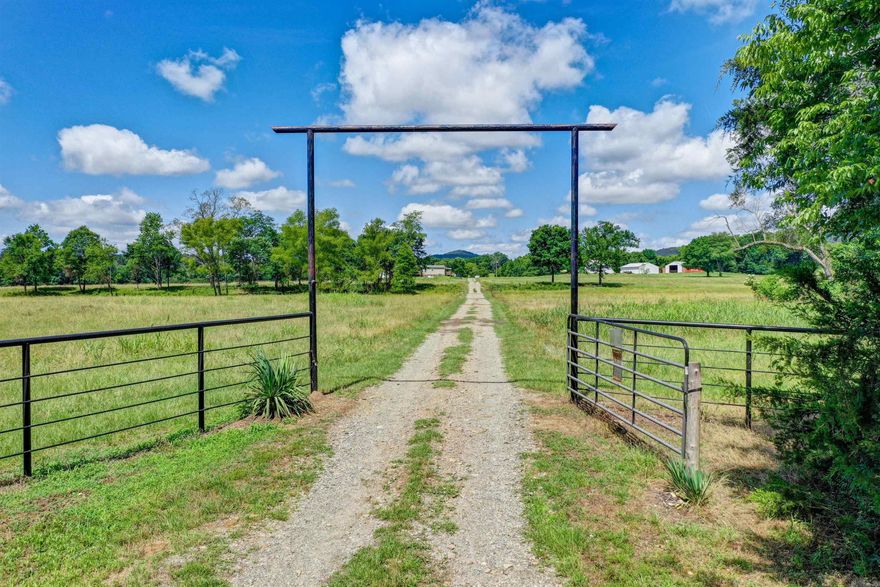 Welcome to your own private paradise! This stunning 119+/- acre farm is an absolute dream come true for nature enthusiasts and those yearning for tranquility. With an array of natural wonders, including creeks, ponds, and natural springs, this property is a true haven.  As you enter, you'll be greeted by an exceedingly nice manufactured home that exudes comfort and style. A detached 2-car garage provides ample space for your vehicles, while the 40x50 metal shop and 40x40 hay barn offer endless possibilities for storage and projects. Additionally, there is a convenient 30x40 shop and a 22kw Generac whole house generator, ensuring that all your needs are taken care of.  One of the highlights of this magnificent property is the presence of four automatic watering systems, perfect for maintaining vibrant gardens or caring for livestock. Embrace the opportunity to grow your own vegetables or create a picturesque grazing area for your animals. The possibilities are endless!  Surrounded by majestic mountains, this home truly provides a private retreat like no other. Immerse yourself in the beauty of nature as you explore your own backyard, or simply relax and enjoy the serene atmosphere.