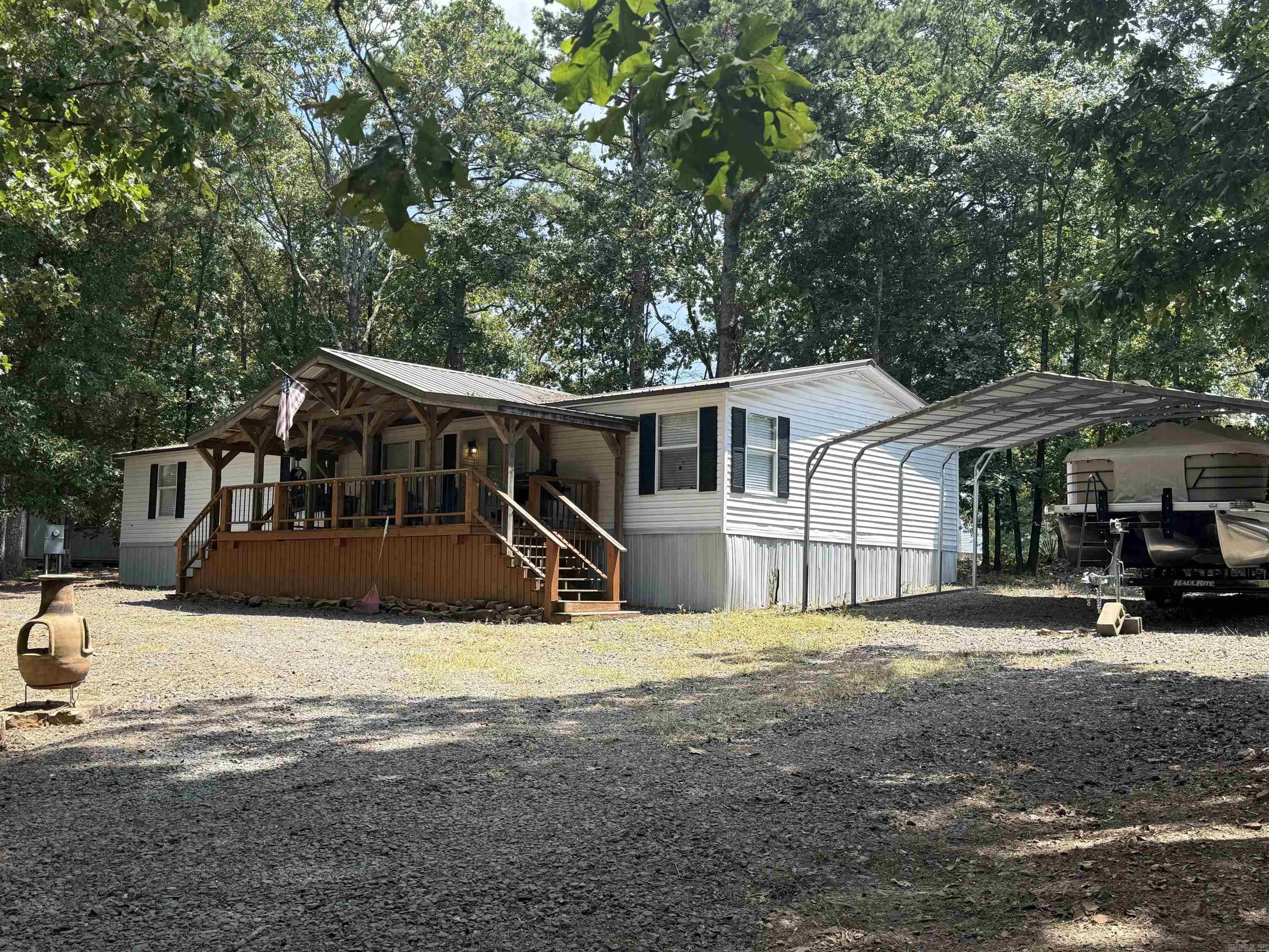 Charming FULLY FURNISHED mobile home on one acre - only minutes from Greers Ferry Lake! This beautiful mobile home sits on a spacious one acre lot just 4 miles from Hill Creek Marina. Whether you're looking for a weekend getaway, full-time residence, or an investment property, this one checks all the boxes! From furniture to decor, everything stays! Just bring your clothes! Outside, enjoy the convenience of a 12x16 storage shed and a 20x25 detached carport for vehicles or boat storage. Full RV hookup adds even more versatility for guests. Don't miss this opportunity to own a lake retreat with space, convenience and value. Schedule your private showing today!