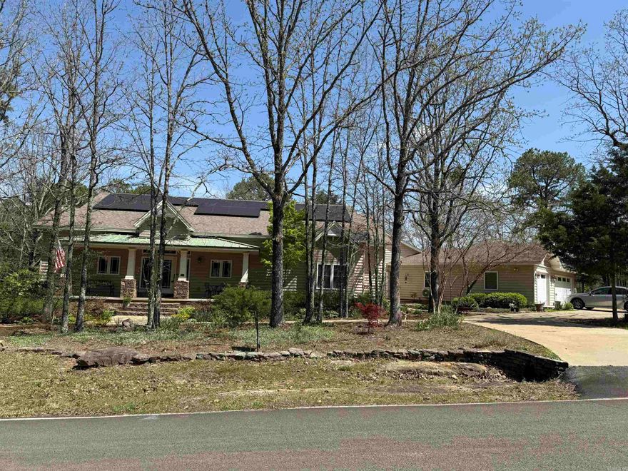 If you are looking for a beautiful & natural woodland setting, this could be for you! With approx. 2700 sq. ft., you'll enjoy a dream kitchen with granite countertops, stainless appliances, walk-in pantry, custom cabinetry with pull-out spice racks, recycle center. in an efficient work triangle with huge island.  The kitchen is open to the greatroom that has a ventless gas fireplace & lots of windows that show off the back deck & a view of the lichen-covered rocky back yard, & valley view beyond back edge.  You can also see the more formal dining area & wet bar.  The 3 BR split design allows comfort & privacy in the Master BR suite which is connected to the laundry room, which has a sink,  front-load W/D, & room for an upright freezer.  The other 2 BR have walk-in closets & share a guest Ba are tucked away from the kitchen. The flooring in these areas are wood & tile.  You'll love the sun porch with concrete floor, floor to ceiling windows, & minisplit.  The house is 1 level & handicap accessible from garage/shop to rear entry. Extra unique features:  enclosed crawlspace, high insulation rating with SIPS; solar panels offer low bills, wired for generator.  Too many details to list!