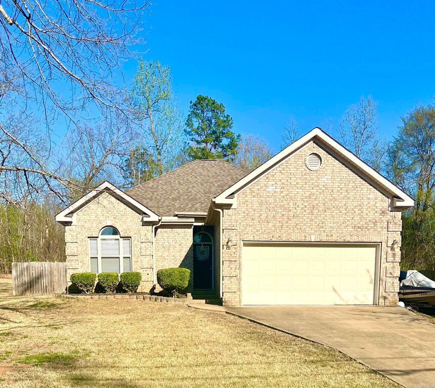 The perfect place to start your next chapter can be found in this beautifully updated 3-bedroom, 2-bath home offering 1,542 sq ft of comfortable living space, all situated on a spacious 0.59-acre lot! Built in 2009, this move-in ready home features fresh paint (2025), LVP flooring, and other thoughtful updates including a dryer vent booster installed (2022), new planter boxes and new cabinets & shelves in the laundry room to make everyday living easy. The kitchen includes laminate countertops, stainless steel appliances and a refrigerator that conveys with the sale of the home, while major systems have been recently updated, including a newer roof (2022), HVAC (2022), and water heater (2021). Step outside to enjoy a fully fenced backyard with a covered patio, complete with newer cedar posts, perfect for relaxing or entertaining. Located in the desirable Magnet Cove School District, this home checks all the boxes, don’t miss it!